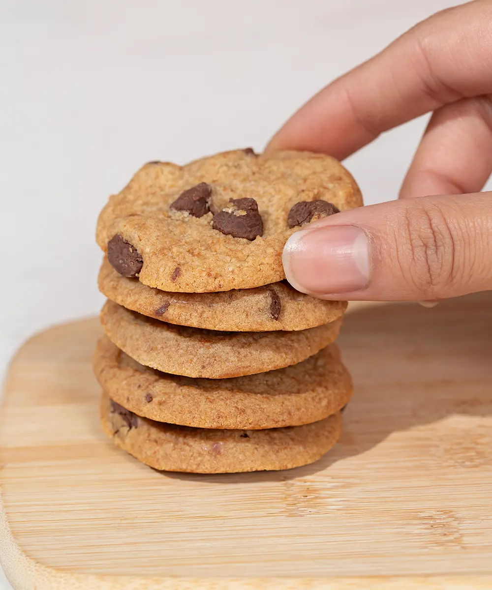 Chewybake Chocolate Chip Cookies stacked on a board